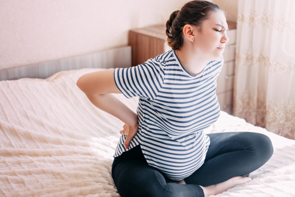 A female chiropractor near me offers safe care for pregnancy-related back pain. - Upright Posture A female chiropractor near me offers safe care for pregnancy-related back pain.
