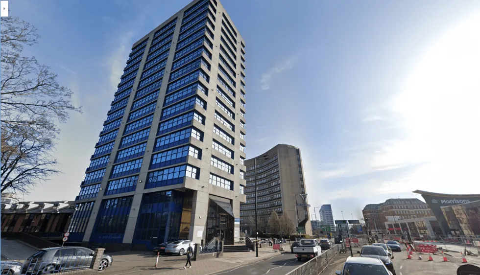 A modern high-rise office, possibly home to a chiropractor near me in Birmingham, providing expert spinal care.
